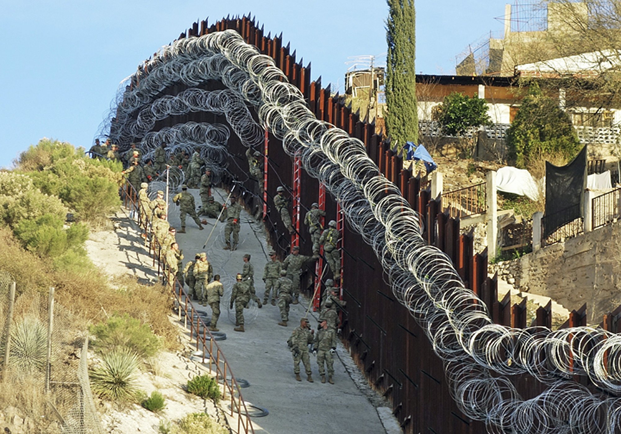 Arizona city officials decry new razor wire on border wall Kingman