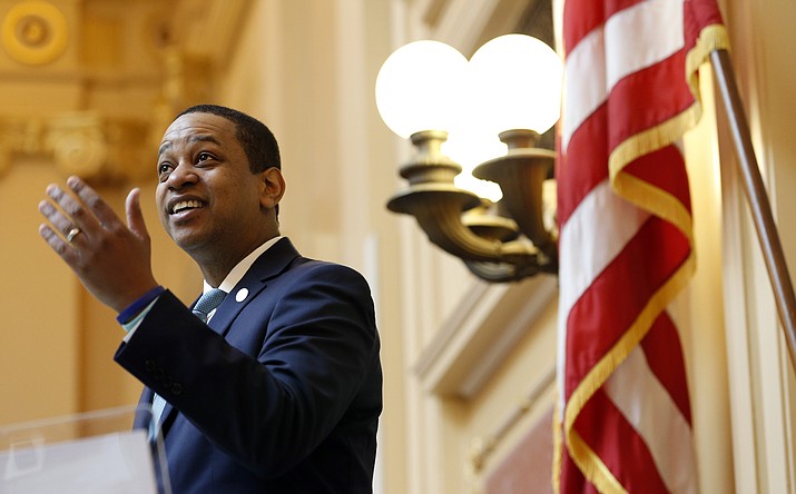 Virginia Lt. Gov Justin Fairfax welcomes visitors to the gallery at the opening of the senate session at the Capitol in Richmond, Va., Thursday, Feb. 7, 2019. A California woman has accused Fairfax of sexually assaulting her 15 years ago. (AP Photo/Steve Helber)