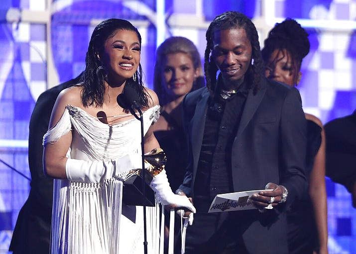 Cardi B, left, accepts the award for best rap album for "Invasion of Privacy" as Offset looks on at the 61st annual Grammy Awards on Sunday, Feb. 10, 2019, in Los Angeles. (Photo by Matt Sayles/Invision/AP)