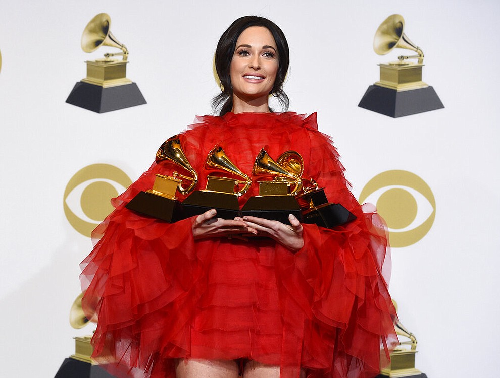 Kacey Musgraves, winner of the awards for best country album for "Golden Hour", best country song for "Space Cowboy", best country solo performance for "Butterflies" and album of the year for "Golden Hour" poses in the press room at the 61st annual Grammy Awards at the Staples Center on Sunday, Feb. 10, 2019, in Los Angeles. (Photo by Chris Pizzello/Invision/AP)