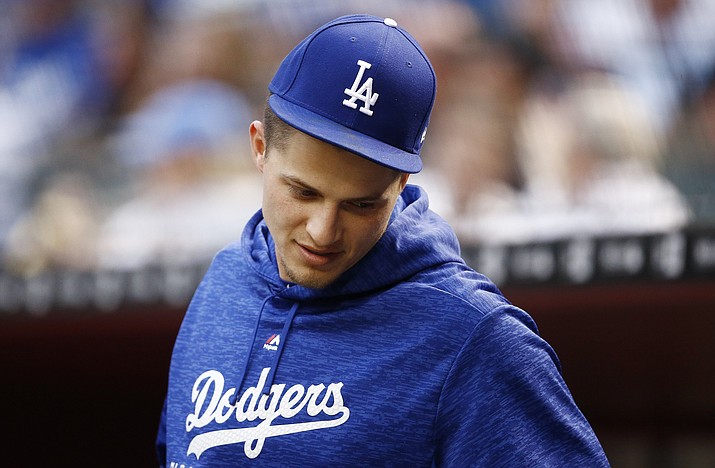 An injured Los Angeles Dodgers’ Corey Seager stands in the dugout prior to a baseball game against the Arizona Diamondbacks on April 30, 2018, in Phoenix. (Ross D. Franklin/AP, file)