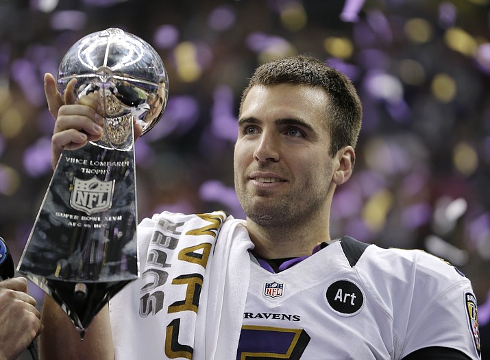 In this Feb. 13, 2013 file photo, Baltimore Ravens quarterback Joe Flacco (5) holds the Vince Lombardi Trophy after defeating the San Francisco 49ers 34-31 in the NFL Super Bowl XLVII football game in New Orleans.  (Matt Slocum/AP, file)