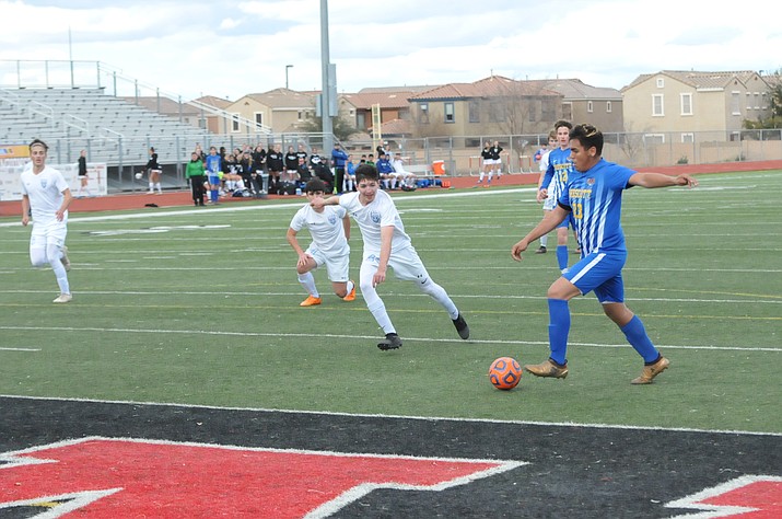 Prescott senior midfielder Bryant Chavira (23) boots in the eventual game-winning goal with about 3-1/2 minutes left in the Badgers’ 4A state semifinals match versus Catalina Foothills Saturday, Feb. 16, 2019, at Williams Field High School in Gilbert. (Doug Cook/Courier)