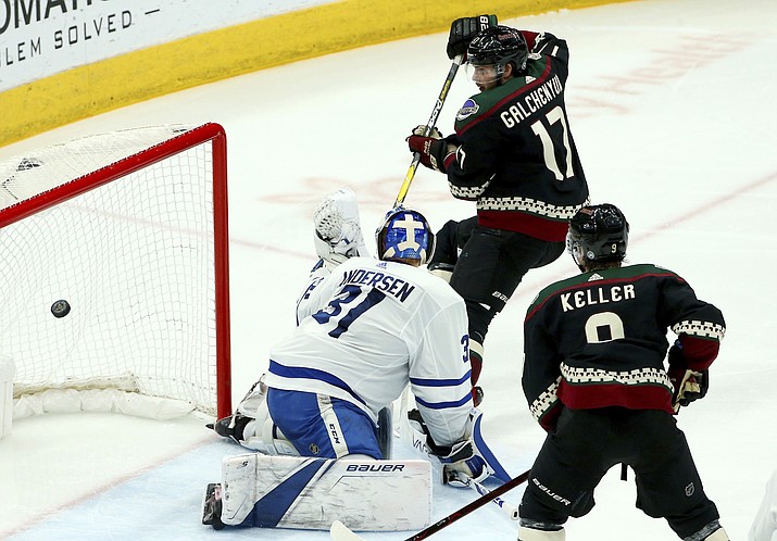 Arizona Coyotes center Alex Galchenyuk (17) sends the puck past Toronto Maple Leafs goaltender Frederik Andersen (31) for a goal as Coyotes center Clayton Keller, right, looks on during the second period of an NHL hockey game Saturday, Feb. 16, 2019, in Glendale, Ariz. (Ross D. Franklin/AP)