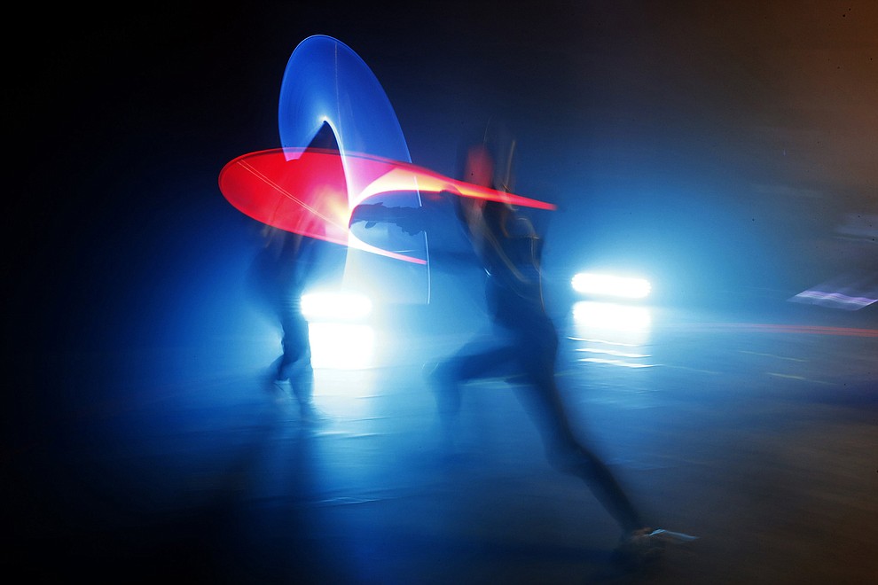 In this Sunday, Feb. 10, 2019, photo, competitors battle during a national lightsaber tournament in Beaumont-sur-Oise, north of Paris. In France, it is easier than ever now to act out "Star Wars" fantasies. The fencing federation has officially recognized lightsaber dueling as a competitive sport. (AP Photo/Christophe Ena)