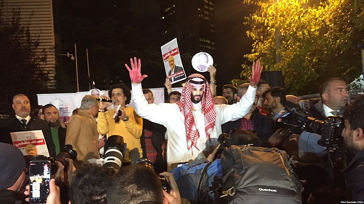 Protest in front of the Consulate General of Saudi Arabia in Istanbul following the murder of Jamal Khashoggi. While some protests are designed to get attention, others hide in plain sight like Easter eggs for the observant. Within sight of the White House, a realistic-looking street sign declares the street Khashoggi Way, after Jamal Khashoggi, the dissident Saudi journalist killed inside the Saudi Consulate in Istanbul. About 10 of these signs have been scattered around Washington. (Hilmi Hacaloğlu (VOA) [Public domain])