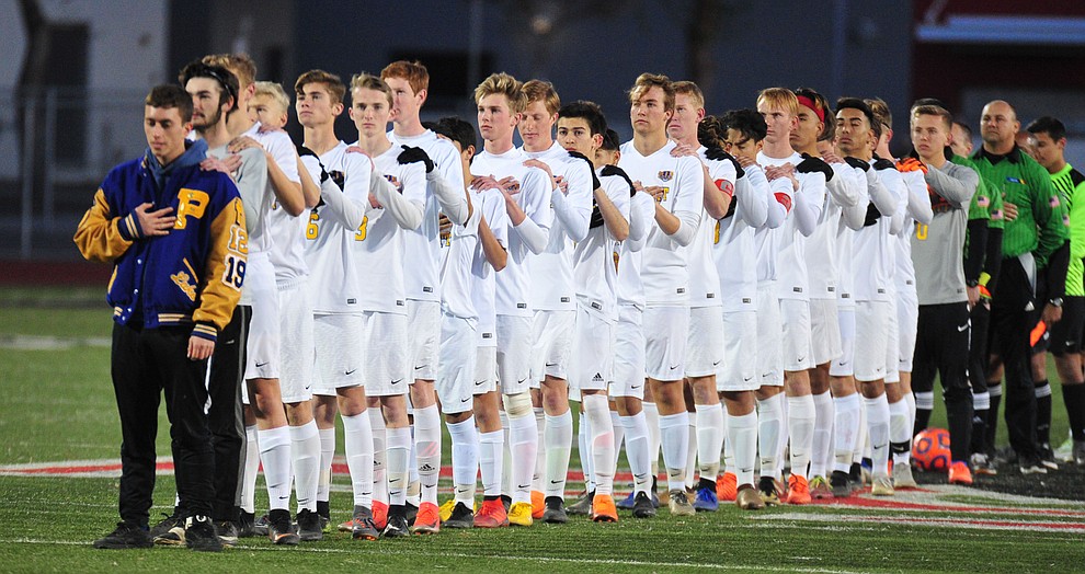 Prescott players stand for the National Anthem as the Badgers take on the Salpointe Catholic Lancers in the Arizona Interscholastic Association 4A State Soccer Championship Tuesday, February 19, 2019 at Williams Field High School in Gilbert. (Les Stukenberg/Courier).