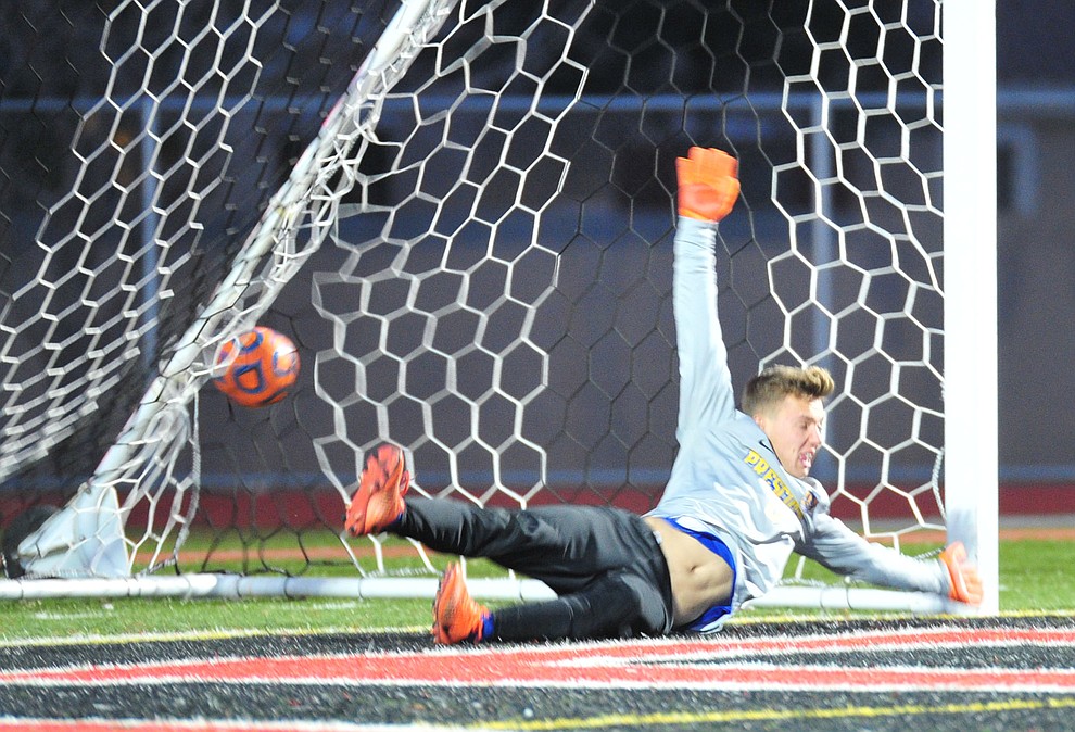 Prescott's Tobias Buettner just misses the stop on an early penalty kick as the Badgers take on the Salpointe Catholic Lancers in the Arizona Interscholastic Association 4A State Soccer Championship Tuesday, February 19, 2019 at Williams Field High School in Gilbert. (Les Stukenberg/Courier).