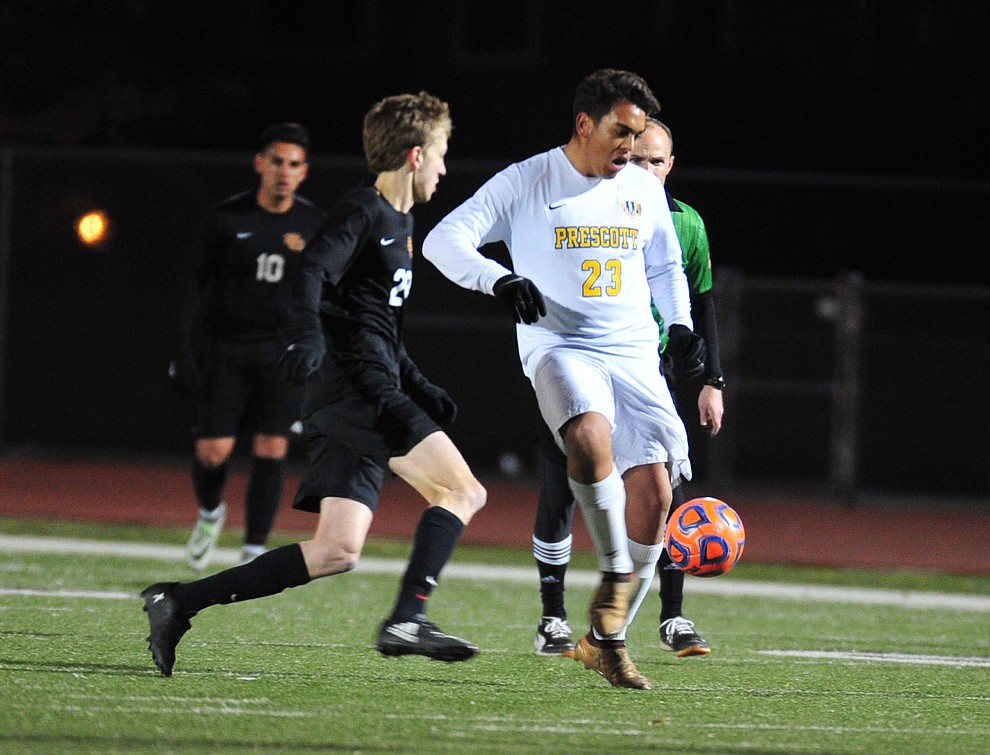 Prescott's Bryant Chavira battles for the ball as the Badgers take on the Salpointe Catholic Lancers in the Arizona Interscholastic Association 4A State Soccer Championship Tuesday, February 19, 2019 at Williams Field High School in Gilbert. (Les Stukenberg/Courier).