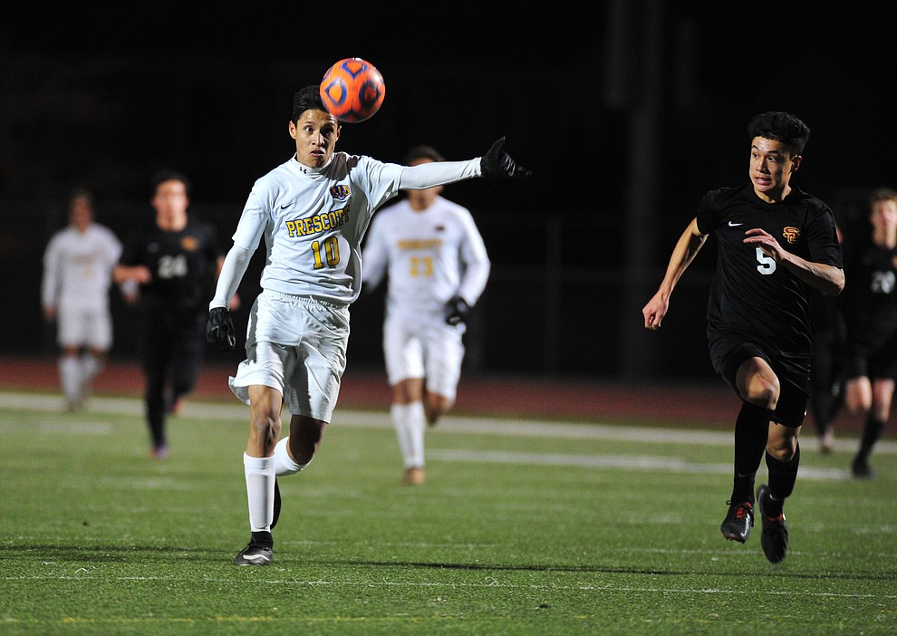 Prescott's Edgar Martinez keeps his eye on the ball as the Badgers take on the Salpointe Catholic Lancers in the Arizona Interscholastic Association 4A State Soccer Championship Tuesday, February 19, 2019 at Williams Field High School in Gilbert. (Les Stukenberg/Courier).