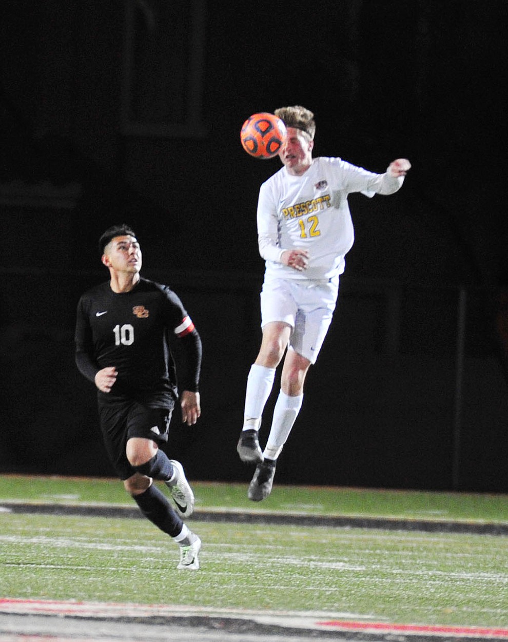 Prescott's Brayden Nelson heads the ball as the Badgers take on the Salpointe Catholic Lancers in the Arizona Interscholastic Association 4A State Soccer Championship Tuesday, February 19, 2019 at Williams Field High School in Gilbert. (Les Stukenberg/Courier).