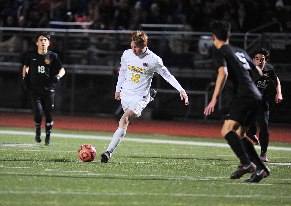 Prescott's Zachary Jones passes the ball as the Badgers take on the Salpointe Catholic Lancers in the Arizona Interscholastic Association 4A State Soccer Championship Tuesday, February 19, 2019 at Williams Field High School in Gilbert. (Les Stukenberg/Courier).