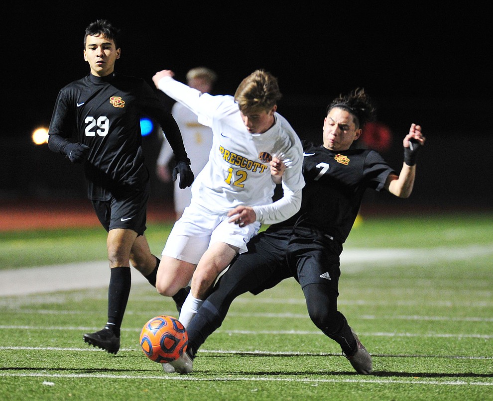 Prescott's Brayden Nelson gets taken down as the Badgers take on the Salpointe Catholic Lancers in the Arizona Interscholastic Association 4A State Soccer Championship Tuesday, February 19, 2019 at Williams Field High School in Gilbert. (Les Stukenberg/Courier).