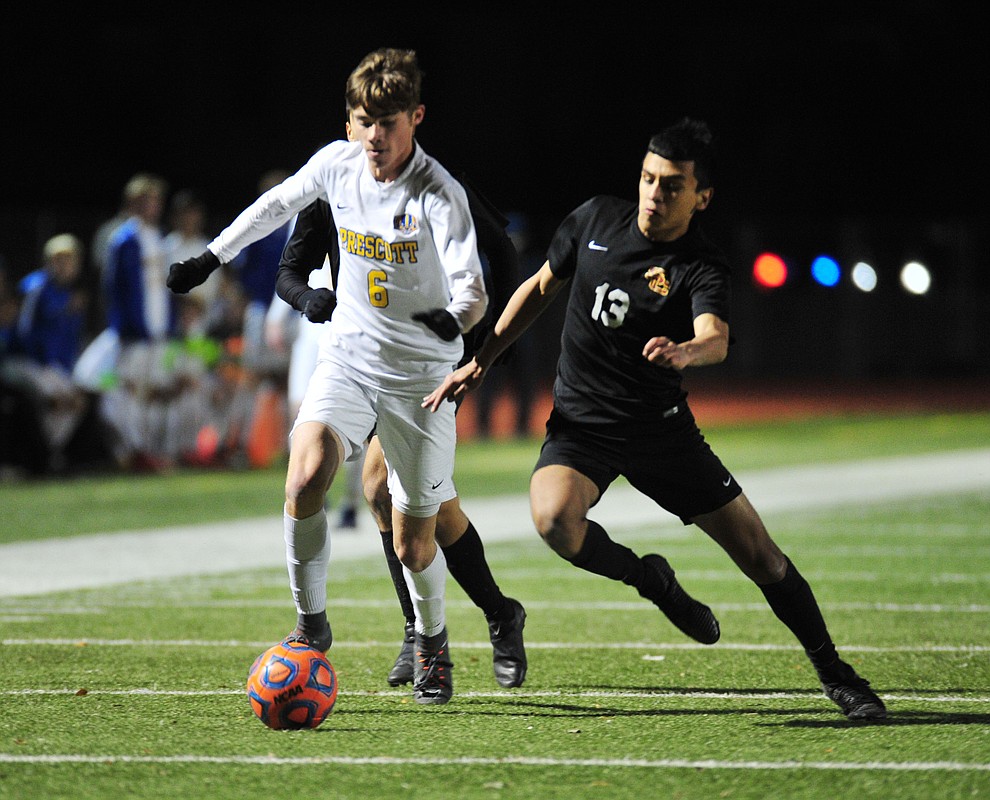 Prescott's Cade Tutrone drives the ball forward as the Badgers take on the Salpointe Catholic Lancers in the Arizona Interscholastic Association 4A State Soccer Championship Tuesday, February 19, 2019 at Williams Field High School in Gilbert. (Les Stukenberg/Courier).