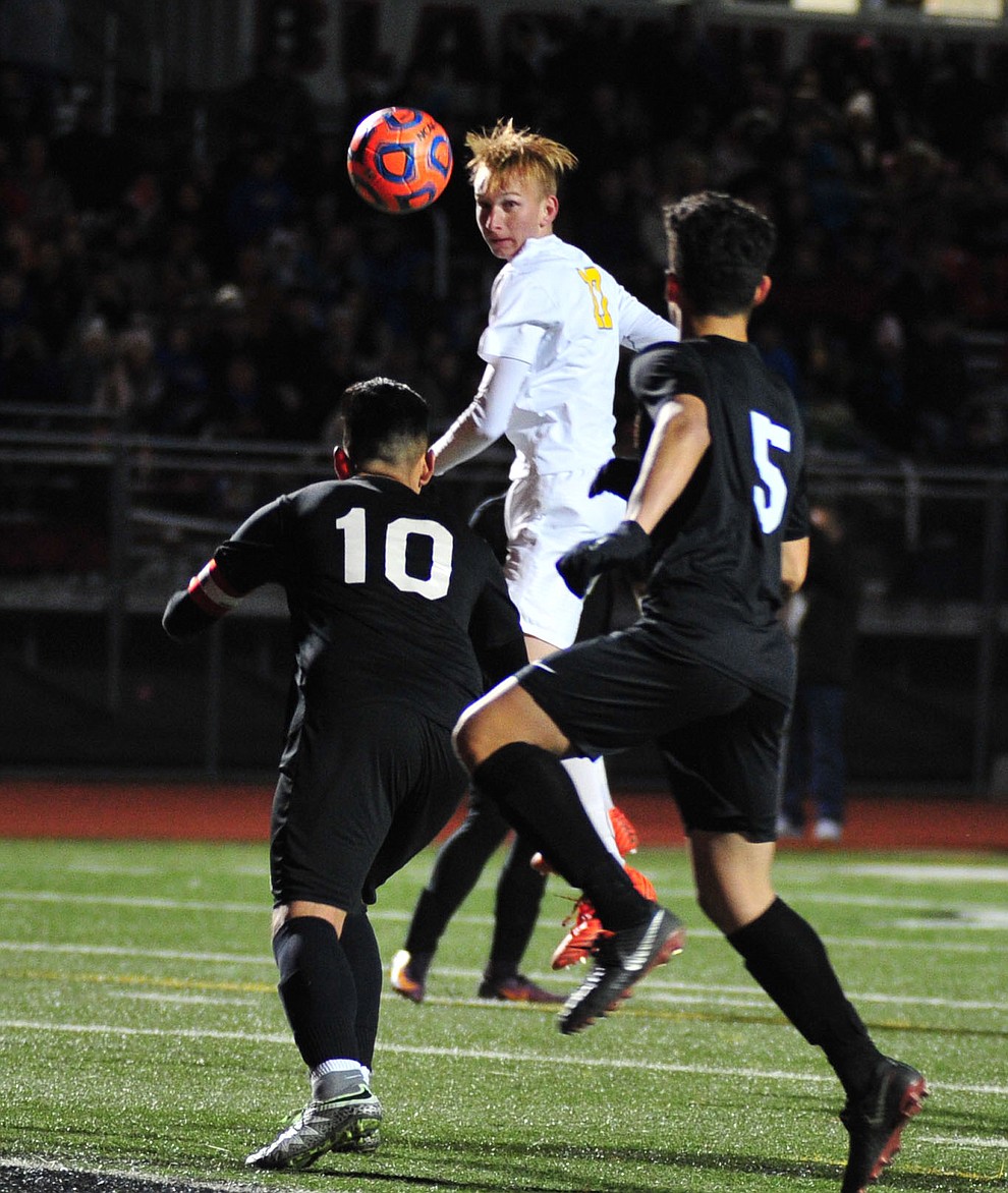 Prescott's Ryan Doyle heads the ball towards the goal as the Badgers take on the Salpointe Catholic Lancers in the Arizona Interscholastic Association 4A State Soccer Championship Tuesday, February 19, 2019 at Williams Field High School in Gilbert. (Les Stukenberg/Courier).