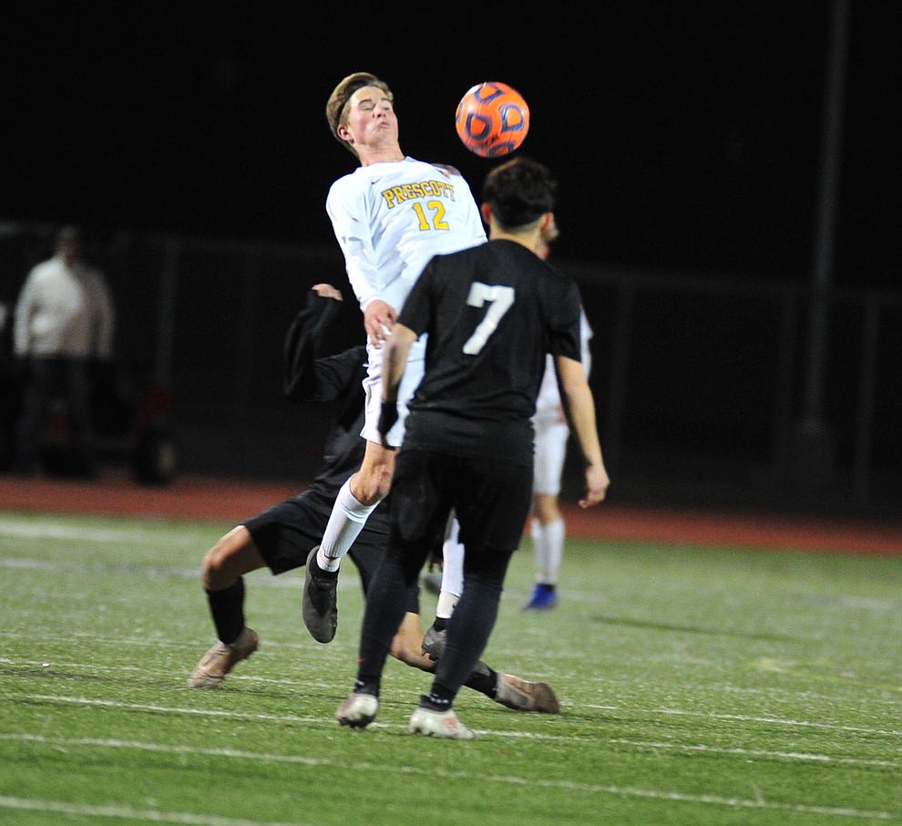 Prescott's Brayden Nelson tries to control the ball as the Badgers take on the Salpointe Catholic Lancers in the Arizona Interscholastic Association 4A State Soccer Championship Tuesday, February 19, 2019 at Williams Field High School in Gilbert. (Les Stukenberg/Courier).
