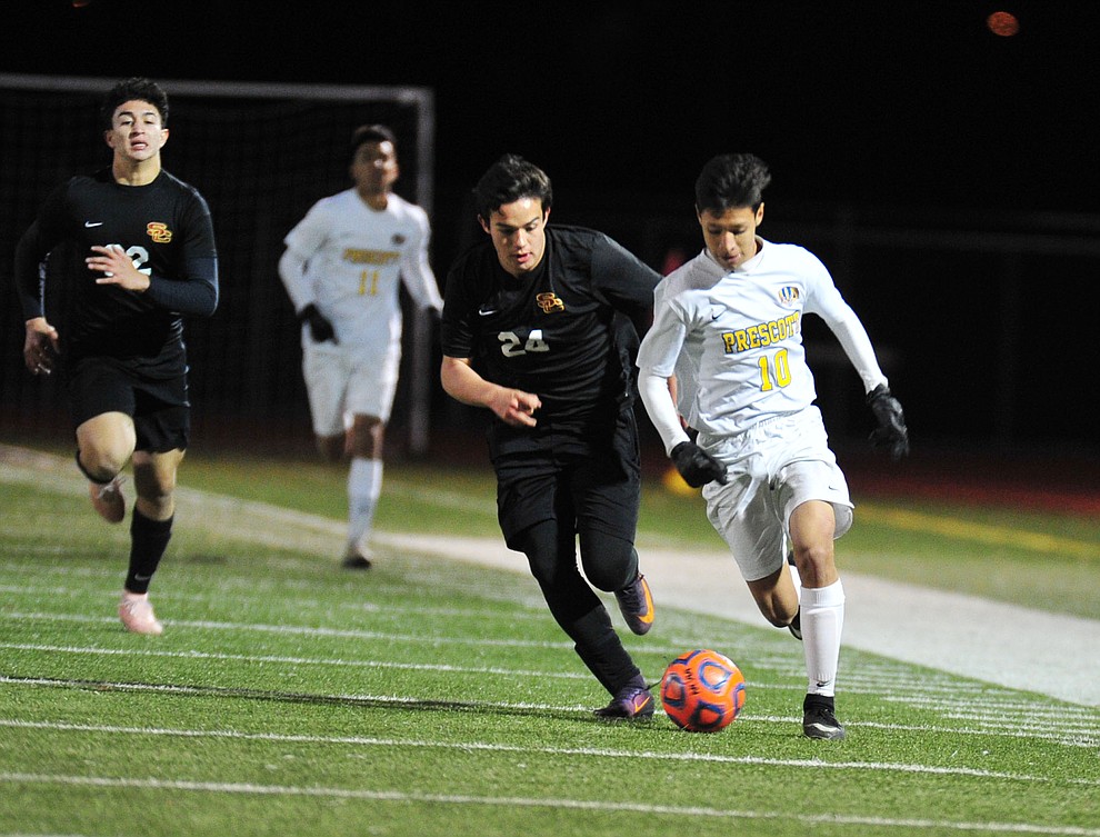 Prescott's Edgar Martinez drives the ball forward as the Badgers take on the Salpointe Catholic Lancers in the Arizona Interscholastic Association 4A State Soccer Championship Tuesday, February 19, 2019 at Williams Field High School in Gilbert. (Les Stukenberg/Courier).
