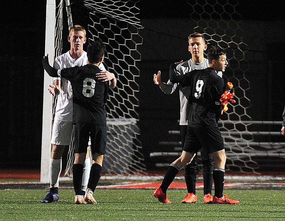 Salpointe Catholic Lancers console Prescott players after they won the Arizona Interscholastic Association 4A State Soccer Championship Tuesday, February 19, 2019 at Williams Field High School in Gilbert. (Les Stukenberg/Courier).