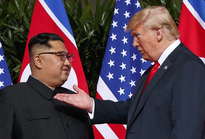 U.S. President Donald Trump, right, meets with North Korean leader Kim Jong Un on June 12, 2018, on Sentosa Island in Singapore. With their second summit fast approaching, speculation is growing that Trump may try to persuade Kim to commit to denuclearization by giving him something he wants more than almost anything else, an announcement of peace and an end to the Korean War. (Evan Vucci/AP, File)