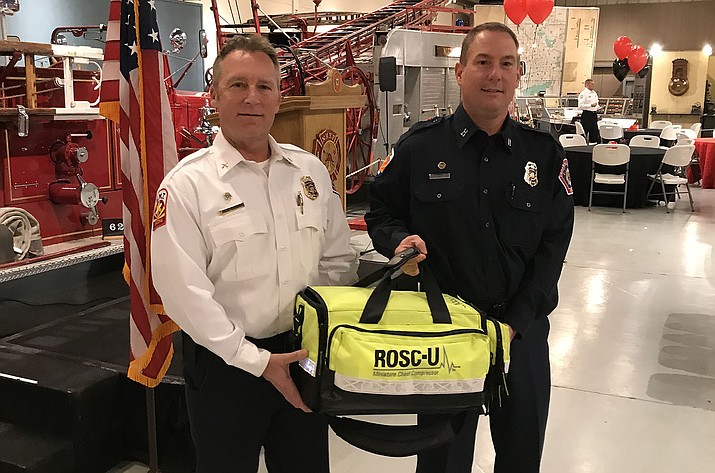 Central Arizona Fire and Medical Authority (CAFMA) Capt. Doug Niemynski and Fire Marshal Rick Chase with one of the agency’s new mechanical chest compression devices Wednesday, Feb. 13, at the Hall of Flame Museum in Phoenix. (Central Arizona Fire and Medical Authority/Courtesy)