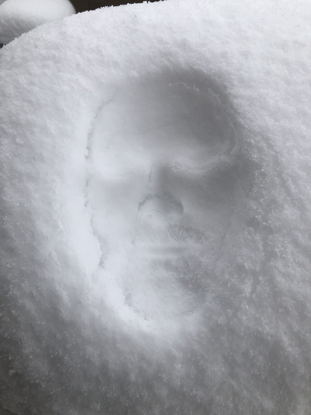 Johnny Schmidt’s snow face on the grill (Kristen Purol)