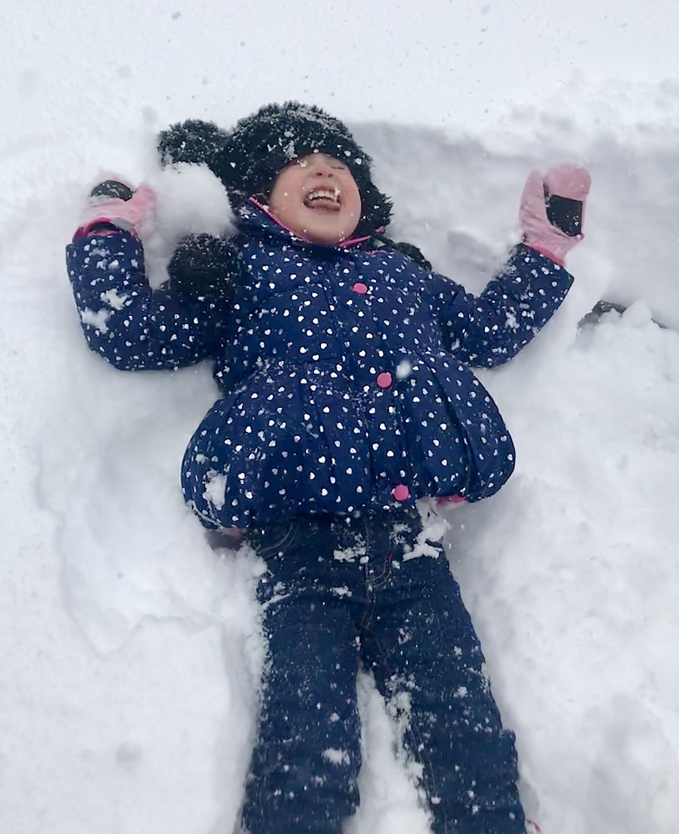 Making snow angels in our front yard in Yavapai Hills by Kahla Ellis