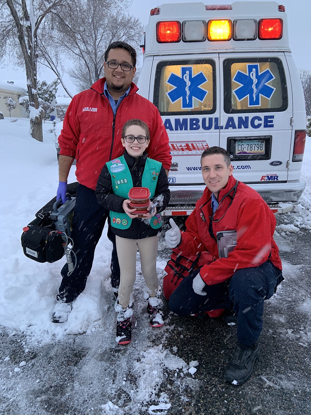 Girl Scout delivers chili to Lifeline crew. Cadence Menei, 11, shares a homemade meal to Prescott crew who braved the weather to respond to a neighborhood call. (Stephanie Menei)