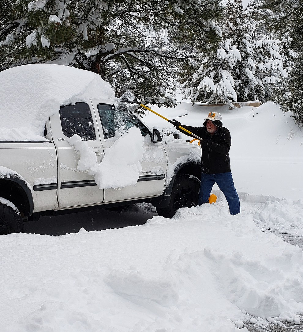 Thursday 2/21/19, digging out.My husband Gary trying to uncover our tundra in our driveway
