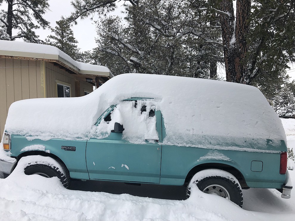 Picture of my Ford Bronco after Wednesday evenings snow. This was taken around noon on Thursday. Body lines of truck can be seen, showing how much snow has fallen on the vehicle alone.