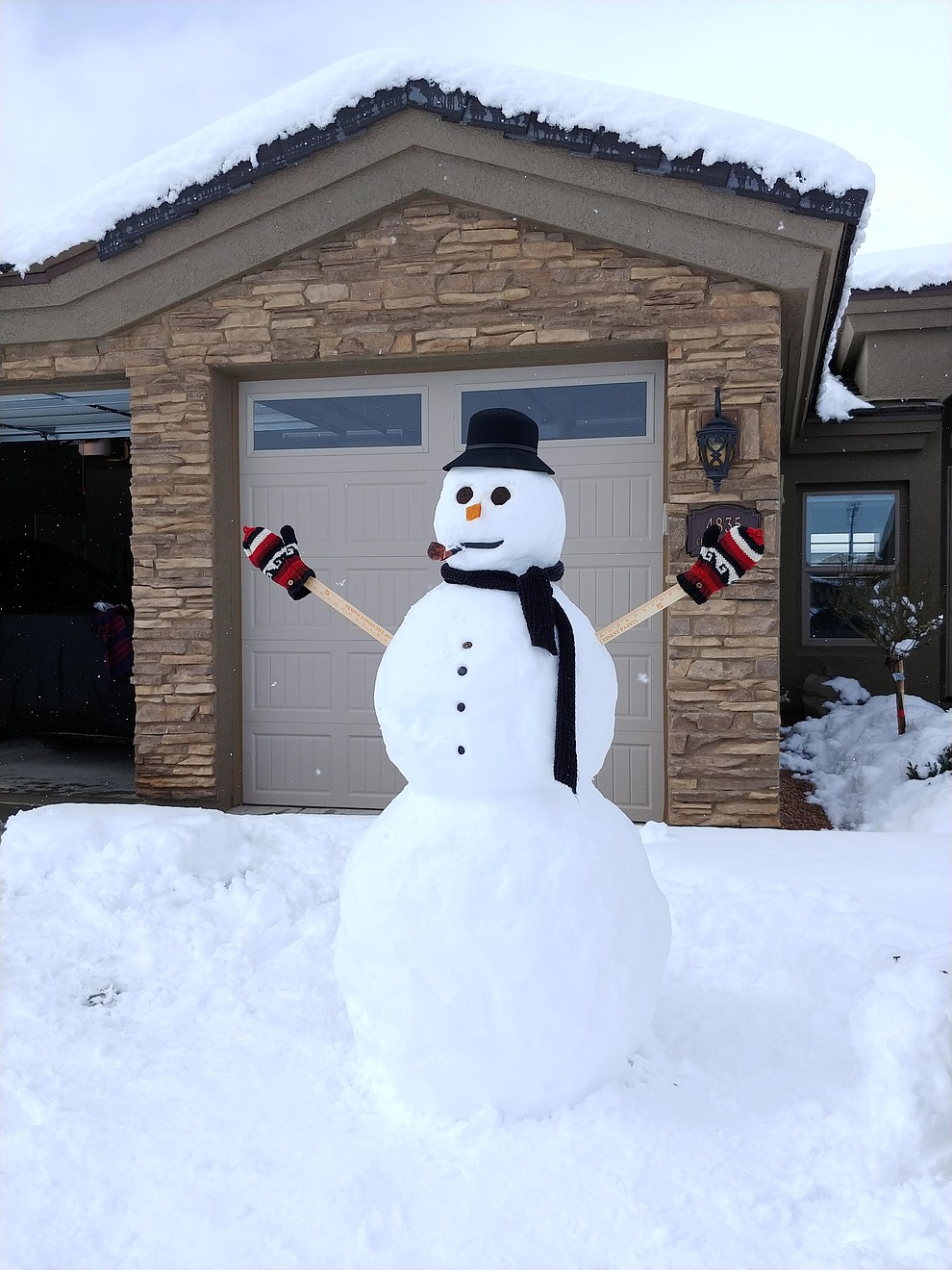 Friendly neighborhood snowman. (Photo submitted by Brian Bakunowski)