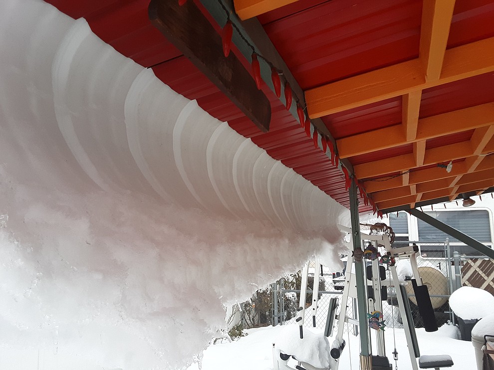 February 22, 2019 Prescott Valley AZ 16:30 Back yard shed. Snow sliding off roof and frozen in place. "The perfect Wave"