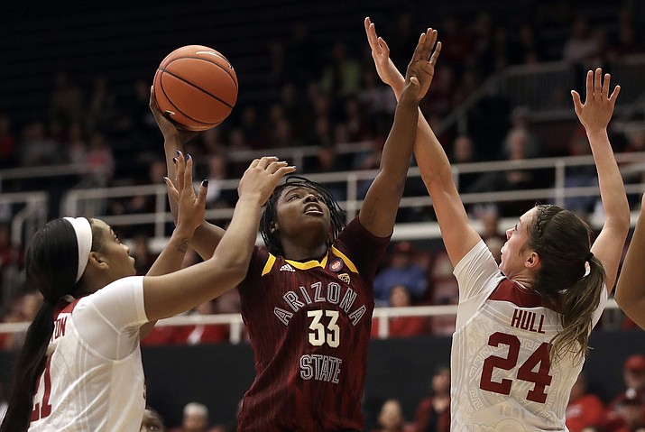 Arizona State's Charnea Johnson-Chapman (33) shoots between Stanford's DiJonai Carrington, left, and Lacie Hull (24) during the first half of an NCAA college basketball game Sunday, Feb. 24, 2019, in Stanford, Calif. (Ben Margot/AP)