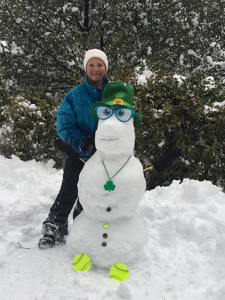 Chloe with Louie the snowman, the newest member of the 2019 Pv clovers softball team