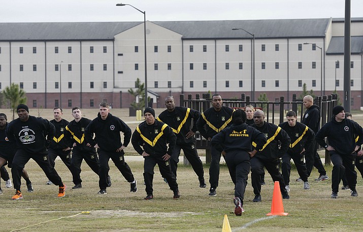In this photo taken Tuesday, Jan. 8, 2019, U.S Army troops training to serve as instructors participate in the new Army combat fitness test at the 108th Air Defense Artillery Brigade compound at Fort Bragg, N.C.  (AP Photo/Gerry Broome)