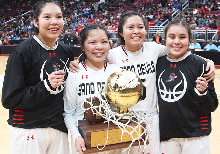 The Page Lady Sand Devils’ seniors pose with the 2019 Arizona 3A State Girls Championship trophy.  From left: Myka Taliman, Mikala Benally, Amy Yellowman and Meagan Fuller. (Anton Wero/NHO)