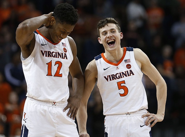 Virginia guard Kyle Guy (5) and guard De’Andre Hunter (12) laugh during the second half of the team’s game against Georgia Tech in Charlottesville, Va., Wednesday, Feb. 27, 2019. Virginia won 81-51. (Steve Helber/AP)