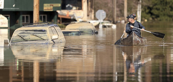 Flood water in Guerneville, Calif., starts to recede on Mill Street leaving behind mud caked reminders of the level of the Russian River, Thursday, Feb. 28, 2019. (Kent Porter/The Press Democrat via AP)