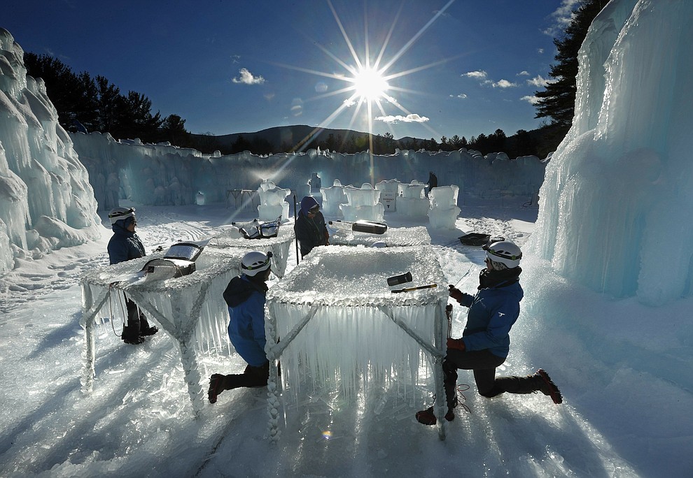 In this Monday, Jan. 28, 2019 photo, icicles are harvested for use in growing the walls at Ice Castles in North Woodstock, N.H. The winter wonderland is one of six in North America. (AP Photo/Robert F. Bukaty)