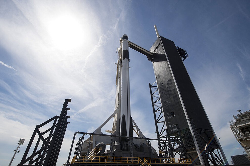 In this image released by NASA, a Falcon 9 SpaceX rocket, ready for launch, sits on pad 39A at the Kennedy Space Center in Cape Canaveral, Fla., Friday, March 1, 2019. The spacecraft's unmanned test flight with the Dragon capsule is scheduled for launch early Saturday morning. (Joel Kowsky/NASA via AP)
