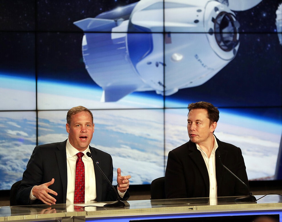 NASA Administrator Jim Bridenstine, left, and Elon Musk, CEO of SpaceX, answer questions during a news conference after the SpaceX Falcon 9 Demo-1 launch at the Kennedy Space Center in Cape Canaveral, Fla., Saturday, March 2, 2019.  (AP Photo/John Raoux)