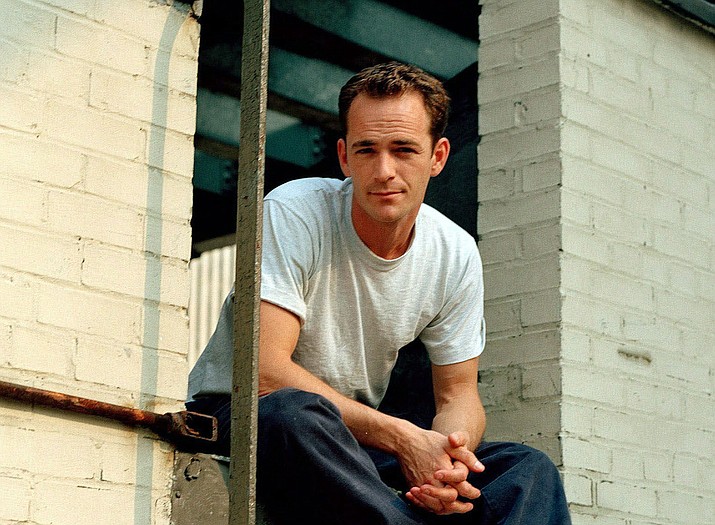 In this June 29, 2001 file photo, actor Luke Perry poses during an interview in New York. A publicist for Perry says the "Riverdale" and "Beverly Hills, 90210" star has died. He was 52. Publicist Arnold Robinson said that Perry died Monday, March 4, 2019, after suffering a massive stroke. (Leslie Hassler/AP, file)