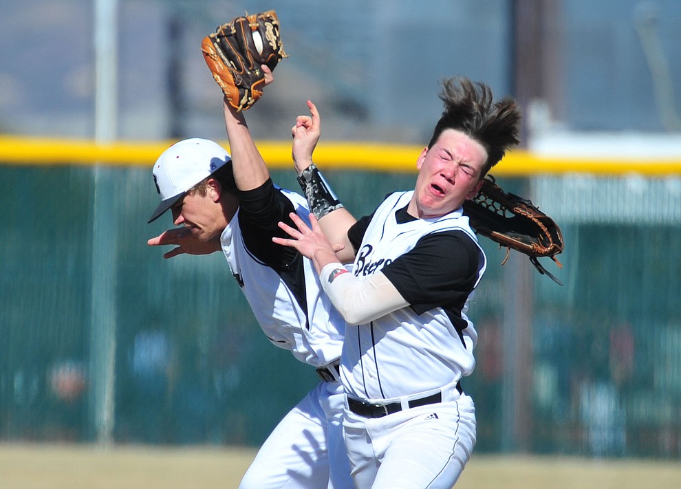 Bradshaw Mountain's Josh Grant and Jordan Massis collide going for a shallow fly ball as the Bears host the Flagstaff Eagles Tuesday, March 5, 2019 in Prescott Valley. (Les Stukenberg/Courier)