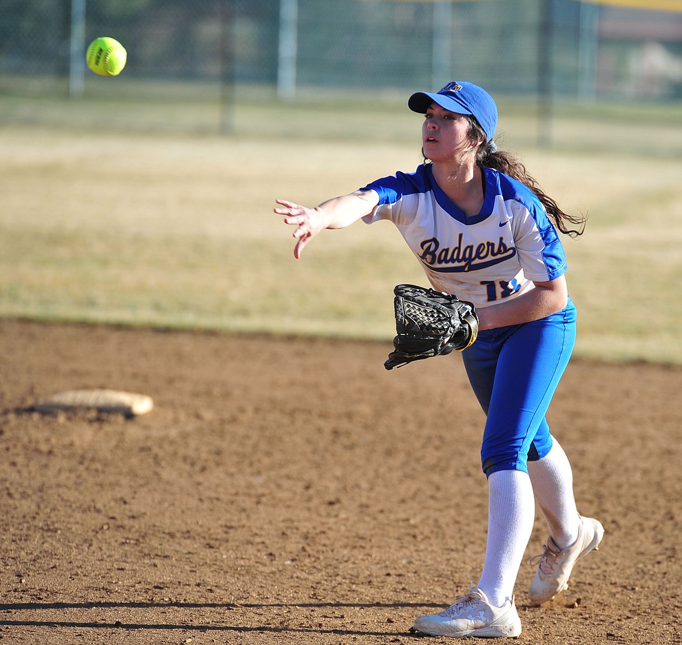 Prescott's Tessa Eppele slides maes the throw from second as the Badgers host the Mingus Marauders Tuesday, March 5, 2019 in Prescott. (Les Stukenberg/Courier)