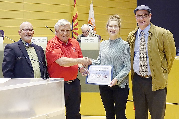 Bradshaw Mountain High School senior Emma Steverson accepts the Student of the Month Award at the Feb. 28 Prescott Valley Town Council meeting. From left are Councilman Marty Grossman, Optimist Club President Butch Miller, Emma Steverson, and Bradshaw Principal Kort Miner. (Heidi Dahms Foster, Town of Prescott Valley/Courtesy)