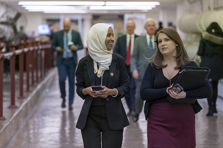 Rep. Ilhan Omar, D-Minn., walks to the chamber Thursday, March 7, 2019, on Capitol Hill in Washington, as the House was preparing to vote on a resolution to speak out against, as Speaker of the House Nancy Pelosi said, "anti-Semitism, anti-Islamophobia, anti-white supremacy and all the forms that it takes," an action sparked by remarks from Omar. (J. Scott Applewhite/AP)