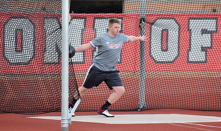 Mingus senior Andrew Swank throws the discus during practice on Wednesday. He broke his shot put record by over six feet at the first meet of the season. VVN/James Kelley