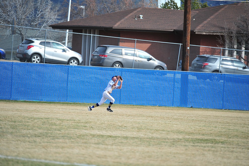 Prescott's Cooper Wells makes the catch in left field as the Badgers host the Mingus Marauders Thursday, March 7, 2019 in their home opener for the 2019 season. (Les Stukenberg/Courier)