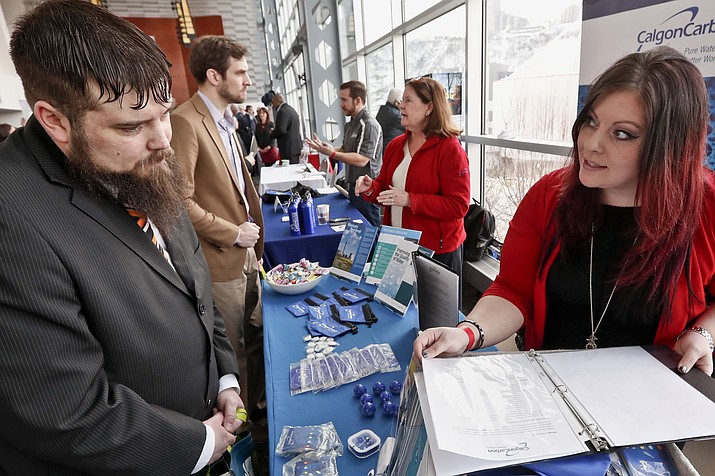 In this Thursday, March 7, 2019, photo visitors to the Pittsburgh veterans job fair meet with recruiters at Heinz Field in Pittsburgh. On Friday, March 8, the U.S. government issues the February jobs report, which will reveal the latest unemployment rate and number of jobs U.S. employers added. (Keith Srakocic/AP)