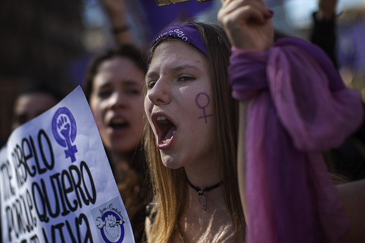 Women march as they shout slogans during the International Women's Day in Barcelona, Spain, Friday, March 8, 2019. Spanish women are marking International Women's Day with a full day strike and dozens of protests across the country against wage gap and gender violence. (AP Photo/Emilio Morenatti)