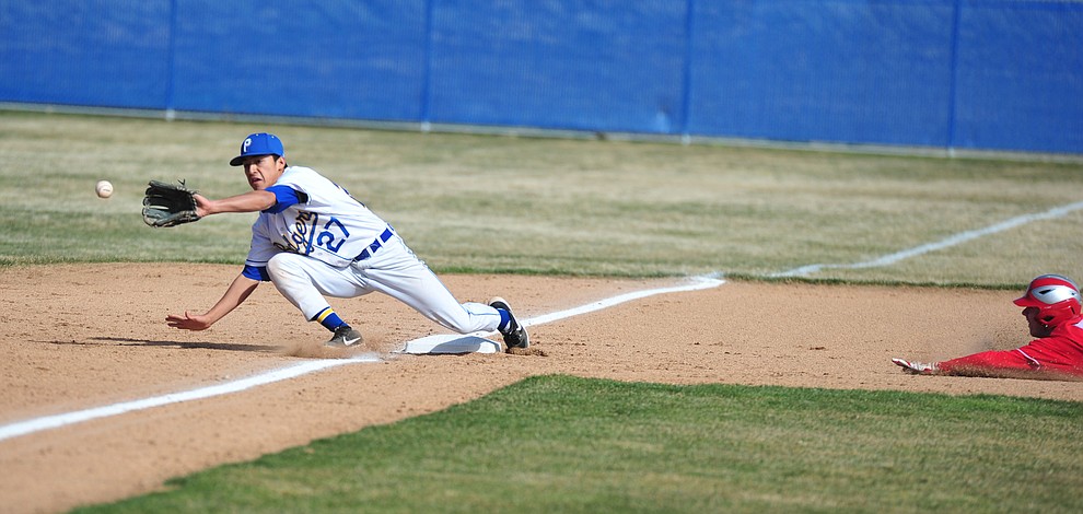 Prescott's Ray Chairez reaches out for throw at third as the Badgers host the Mingus Marauders Thursday, March 7, 2019 in their home opener for the 2019 season. (Les Stukenberg/Courier)